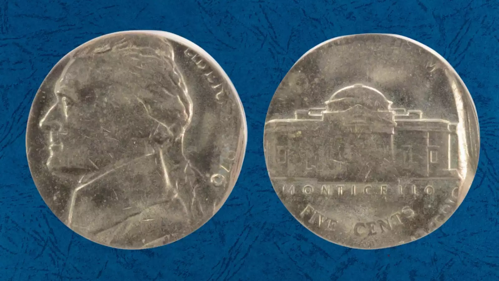 1976 Jefferson nickel wrong planchet error: nickel design struck on a smaller dime planchet, showing size difference and clad edge